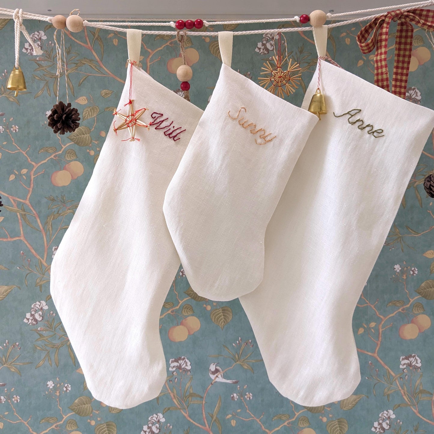 Hand embroidered ivory linen Christmas stocking with custom name