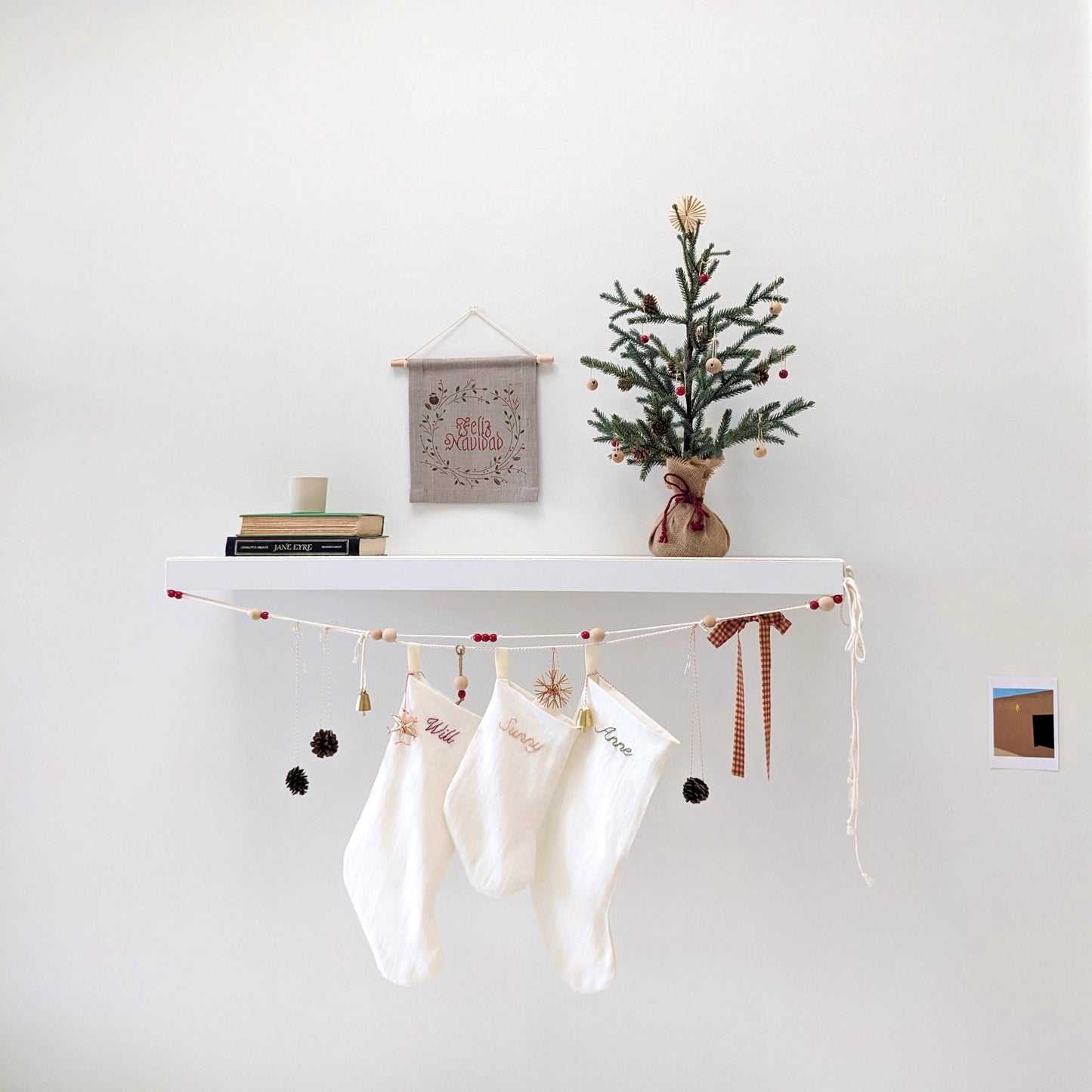 Hand embroidered ivory linen Christmas stocking with personalized name