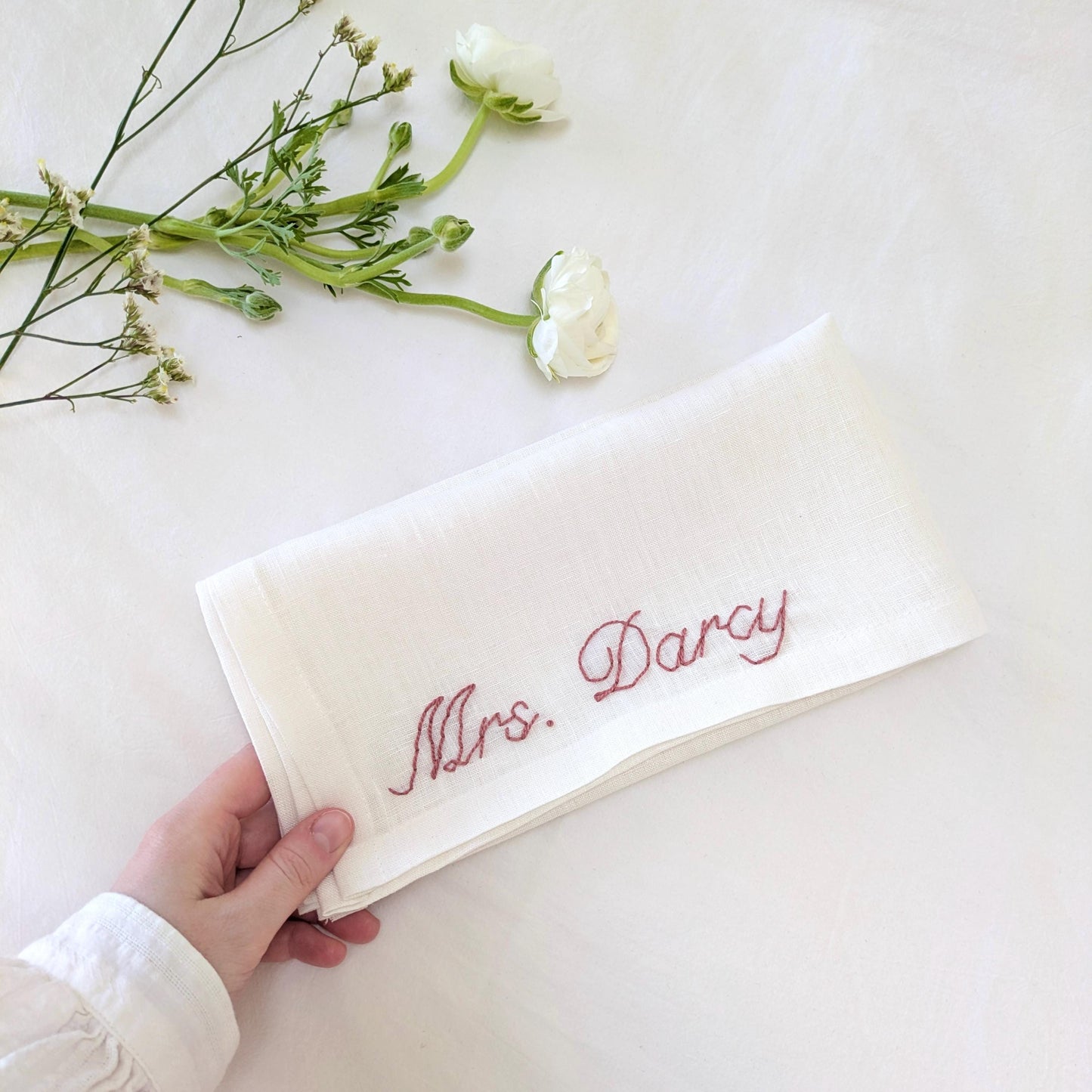 Hand embroidered linen napkin with custom text