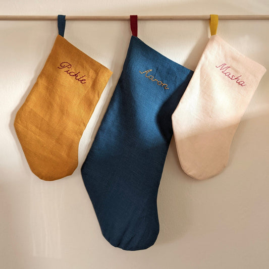 Hand embroidered linen Christmas stocking with personalized name