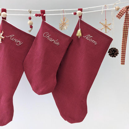 Hand embroidered red linen Christmas stocking with name