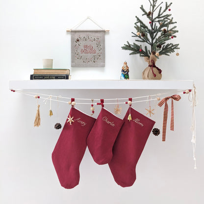 Hand embroidered name linen Christmas stocking in red