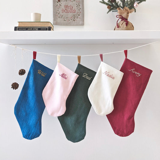 Hand embroidered linen Christmas stocking with custom name