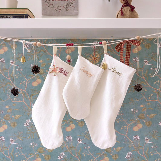 Hand embroidered ivory white linen Christmas stocking with personalized name