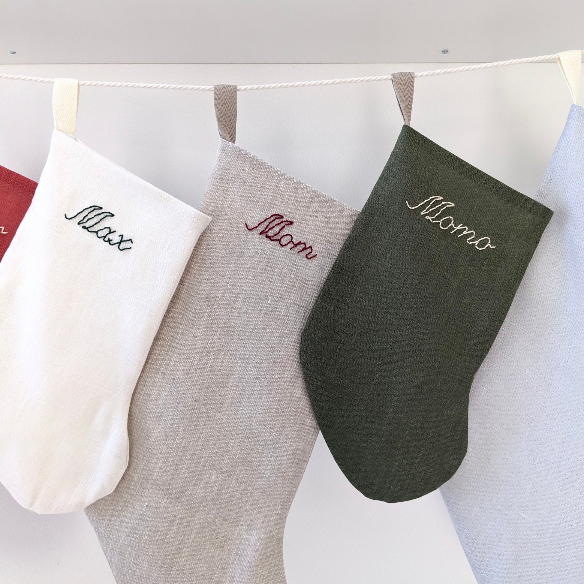 Hand embroidered small linen Christmas stocking with personalized name