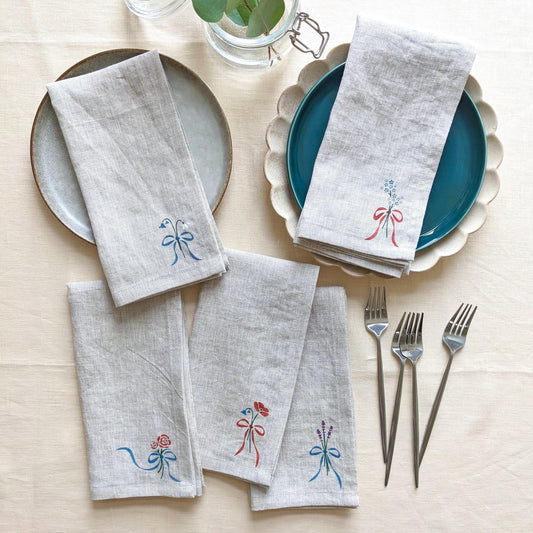 100% linen napkin hand painted with bows, bluebells, snowdrops, forget-me-nots, roses, poppies, or lavender