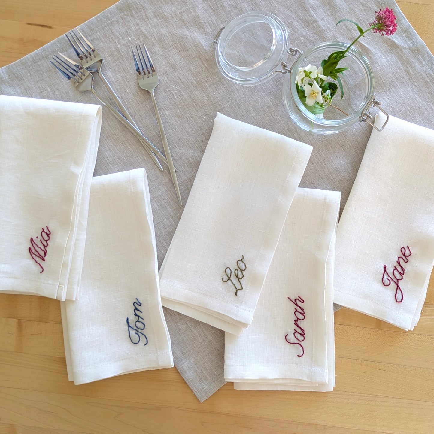 Hand embroidered personalized ivory linen napkin with name