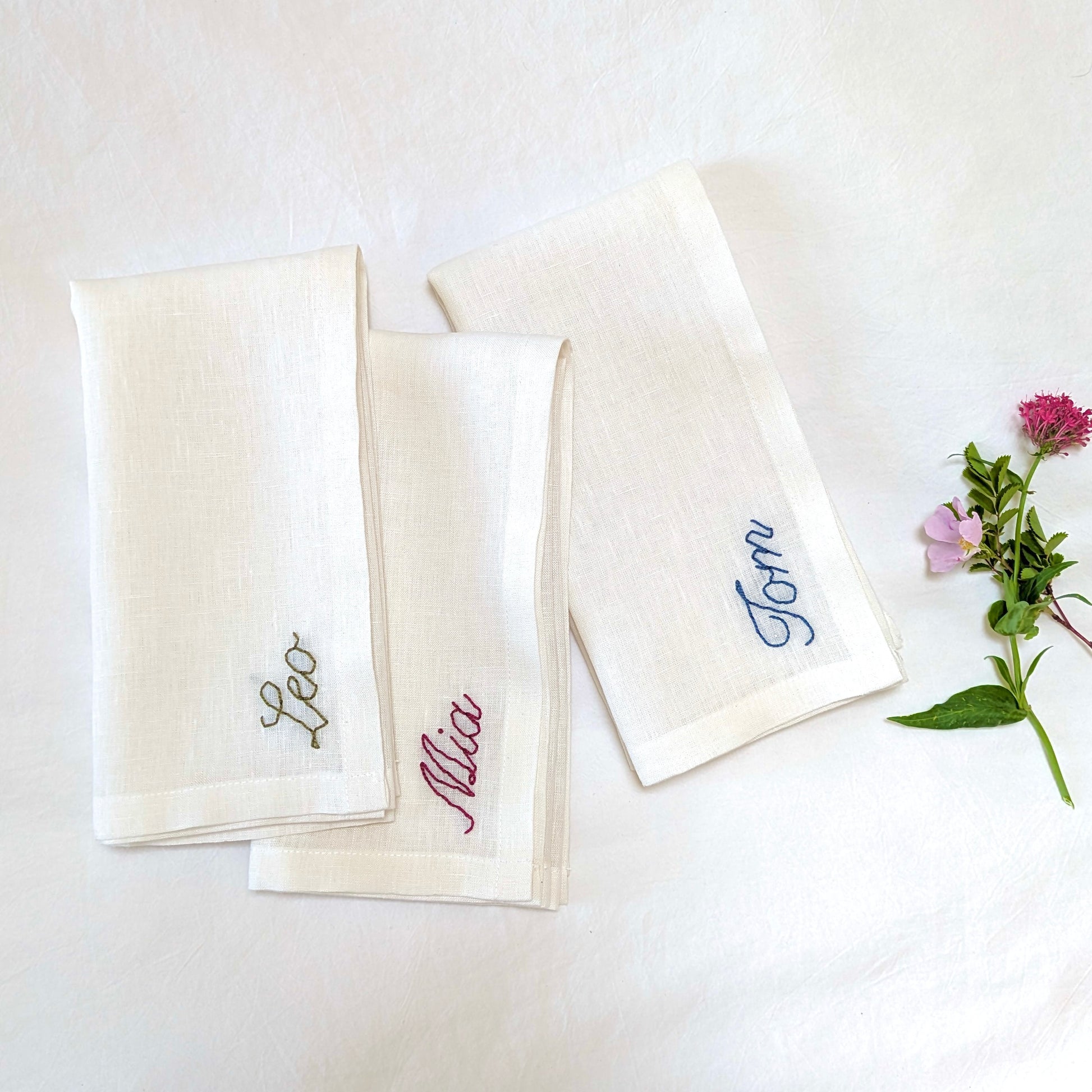 Hand embroidered personalized ivory linen napkin with name