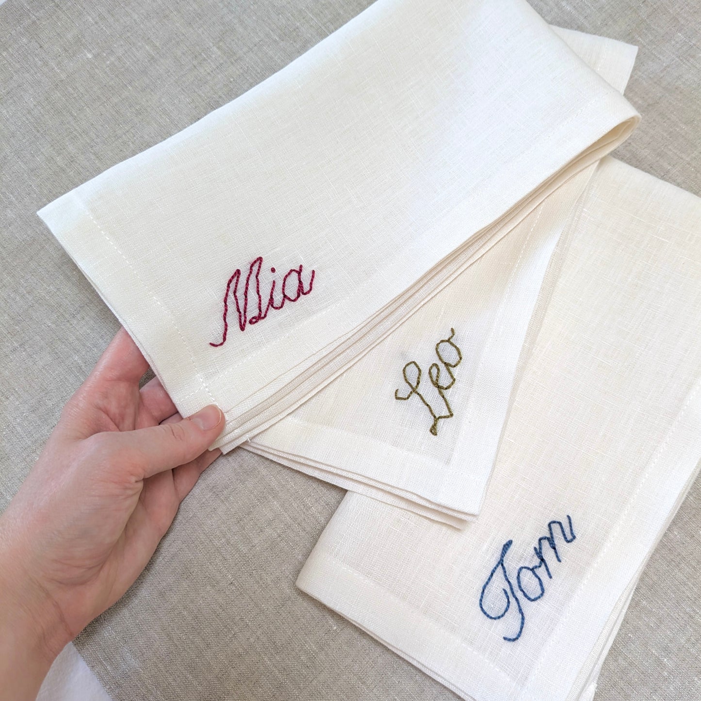 Hand embroidered personalized white linen napkin with name