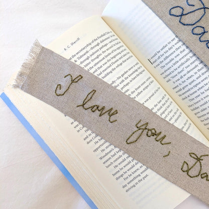 Hand embroidered linen ribbon bookmark that says "I love you, Dad" in your handwriting
