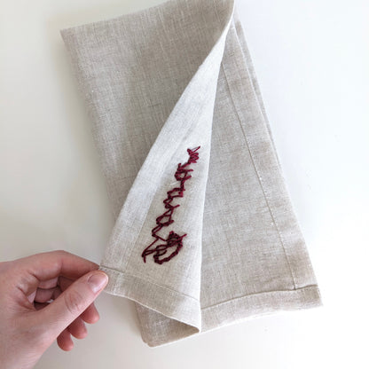 Hand embroidered linen napkin with custom name