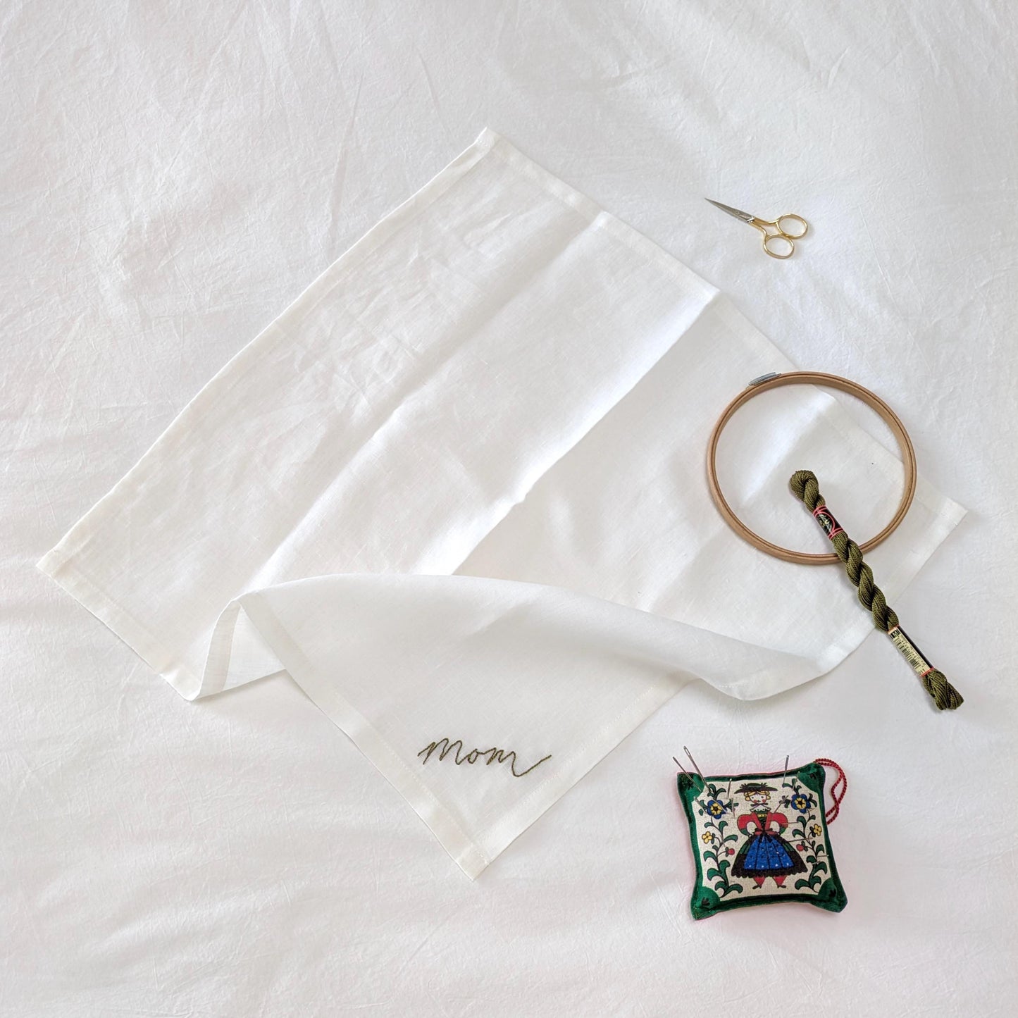 Ivory linen napkin with Mom hand embroidered in your handwriting