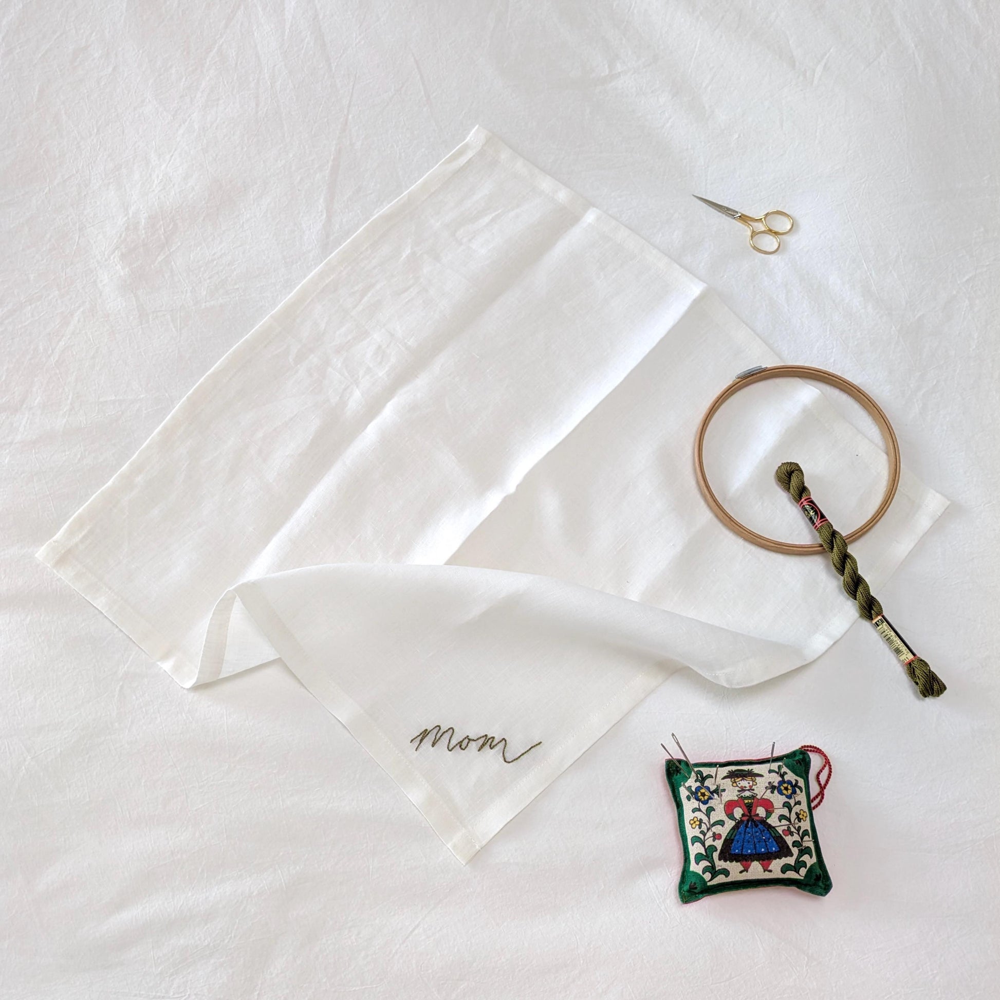 Ivory linen napkin with Mom hand embroidered in your handwriting