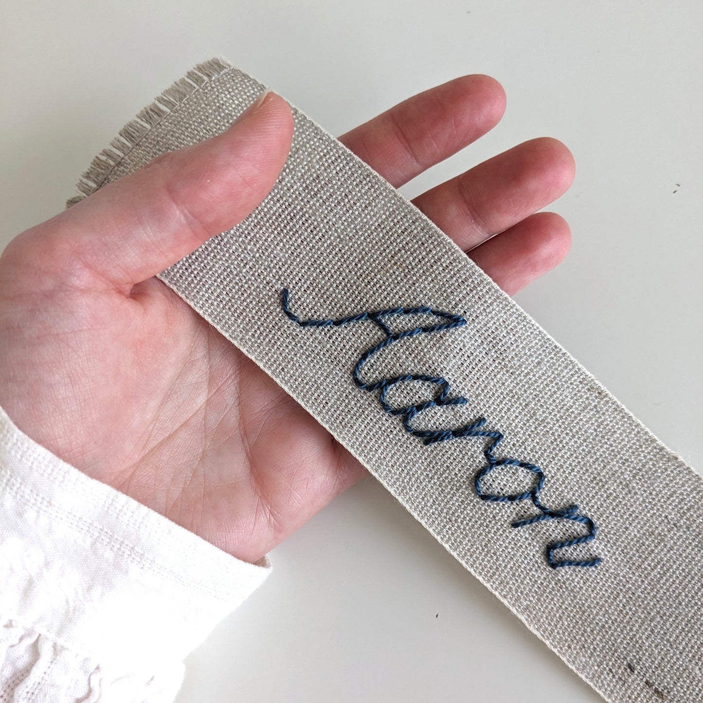 Hand embroidered linen ribbon bookmark with personalized name