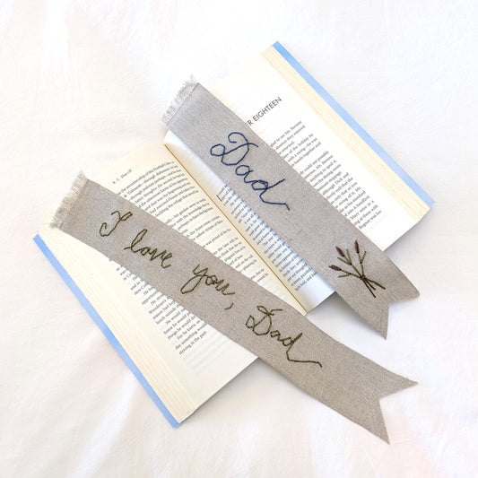 Hand embroidered linen ribbon bookmark that says Dad or a custom phrase in your handwriting