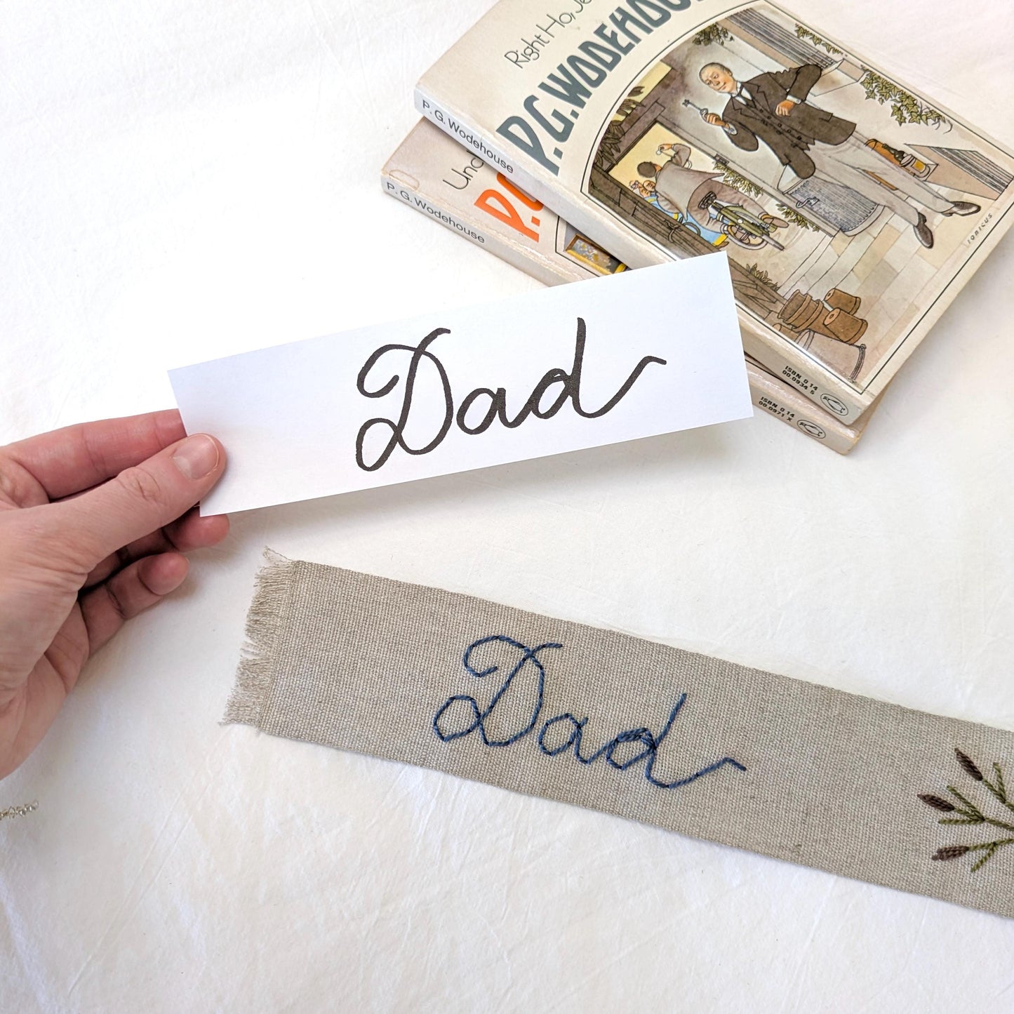 Hand embroidered linen ribbon bookmark that says Dad in your handwriting