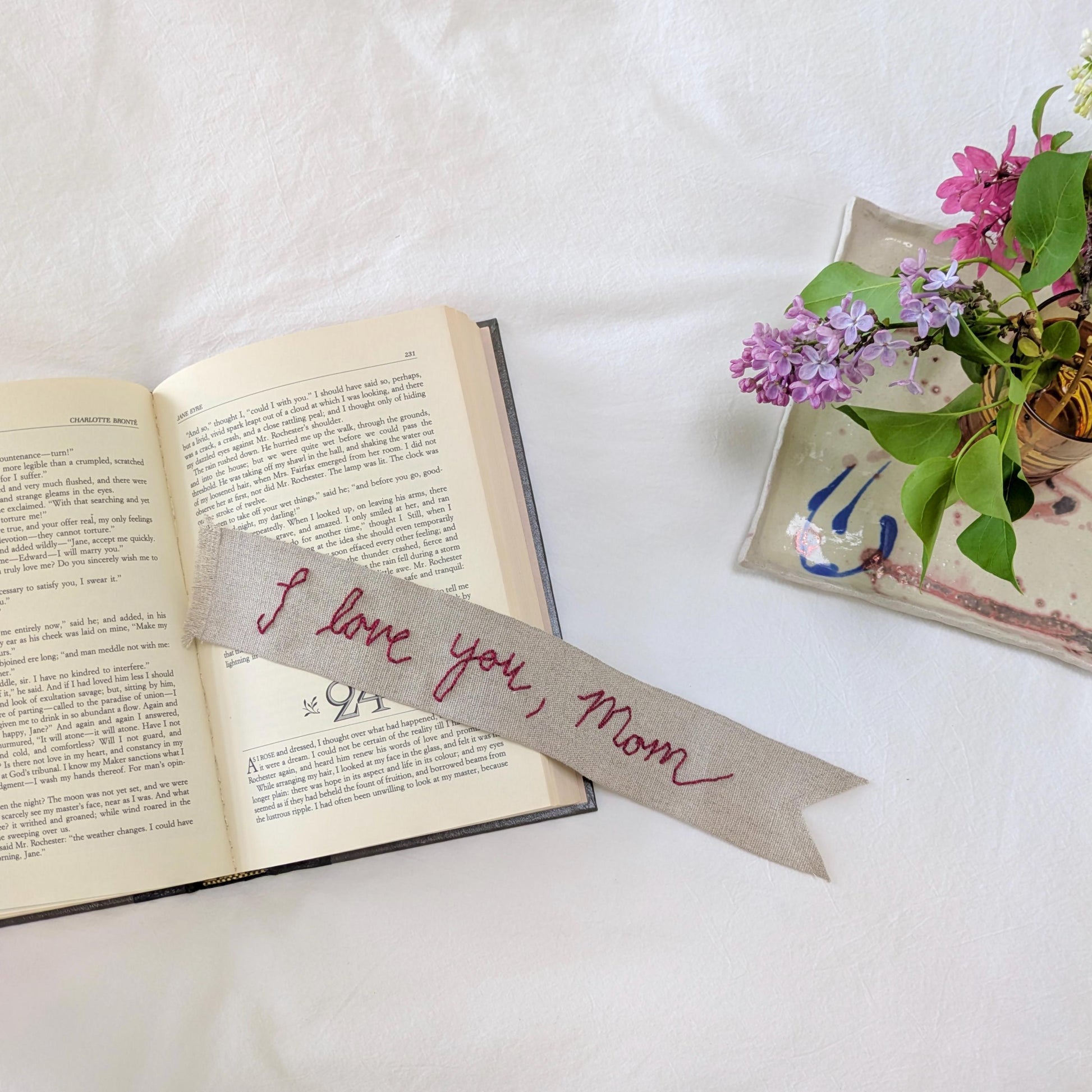 Hand embroidered linen ribbon bookmark that says "I love you, Mom" in your handwriting