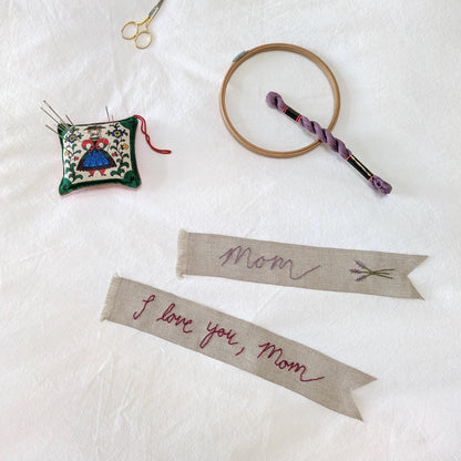 Hand embroidered linen ribbon bookmark that says Mom or a custom phrase in your handwriting