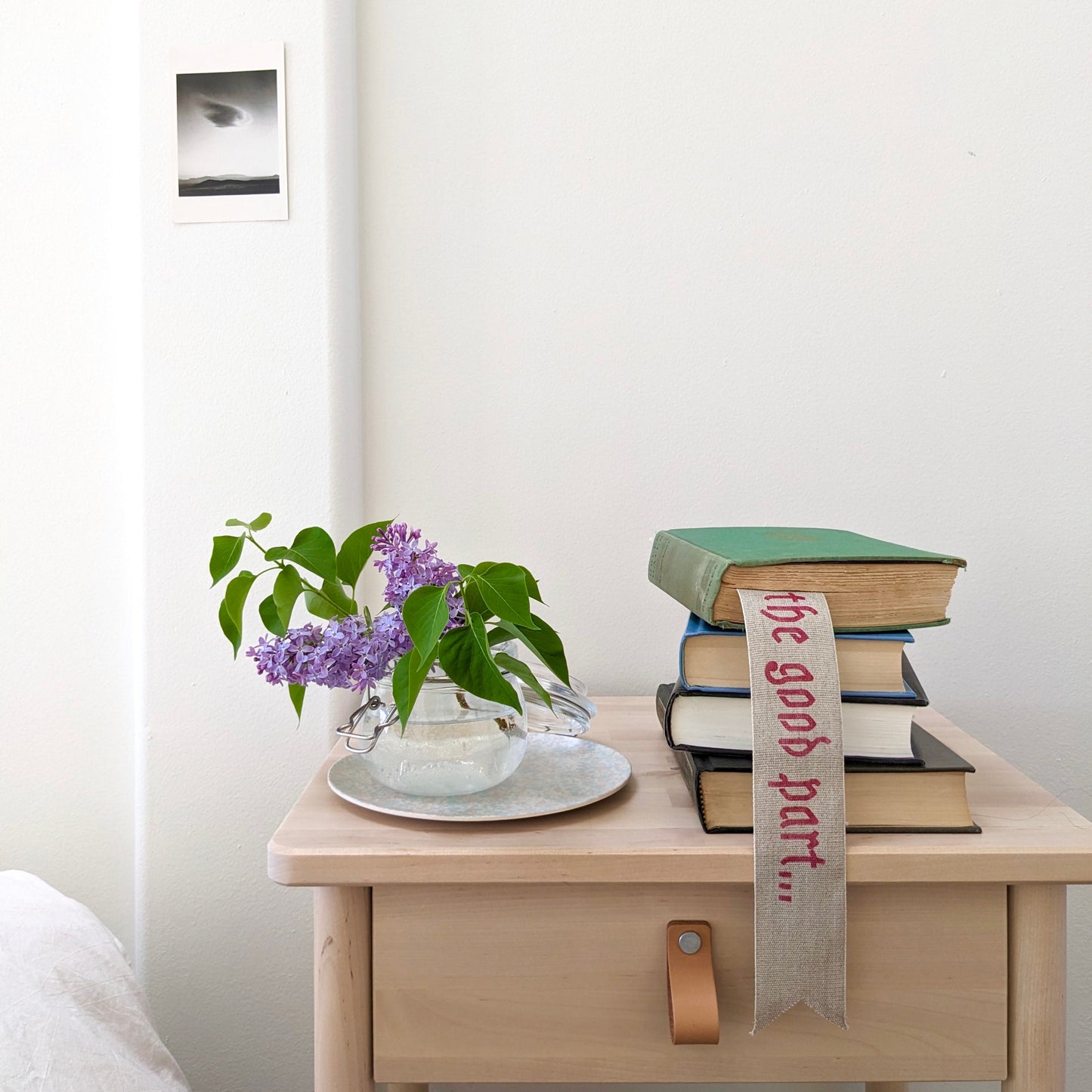 A hand painted linen ribbon bookmark that reads "Just getting to the good part..."
