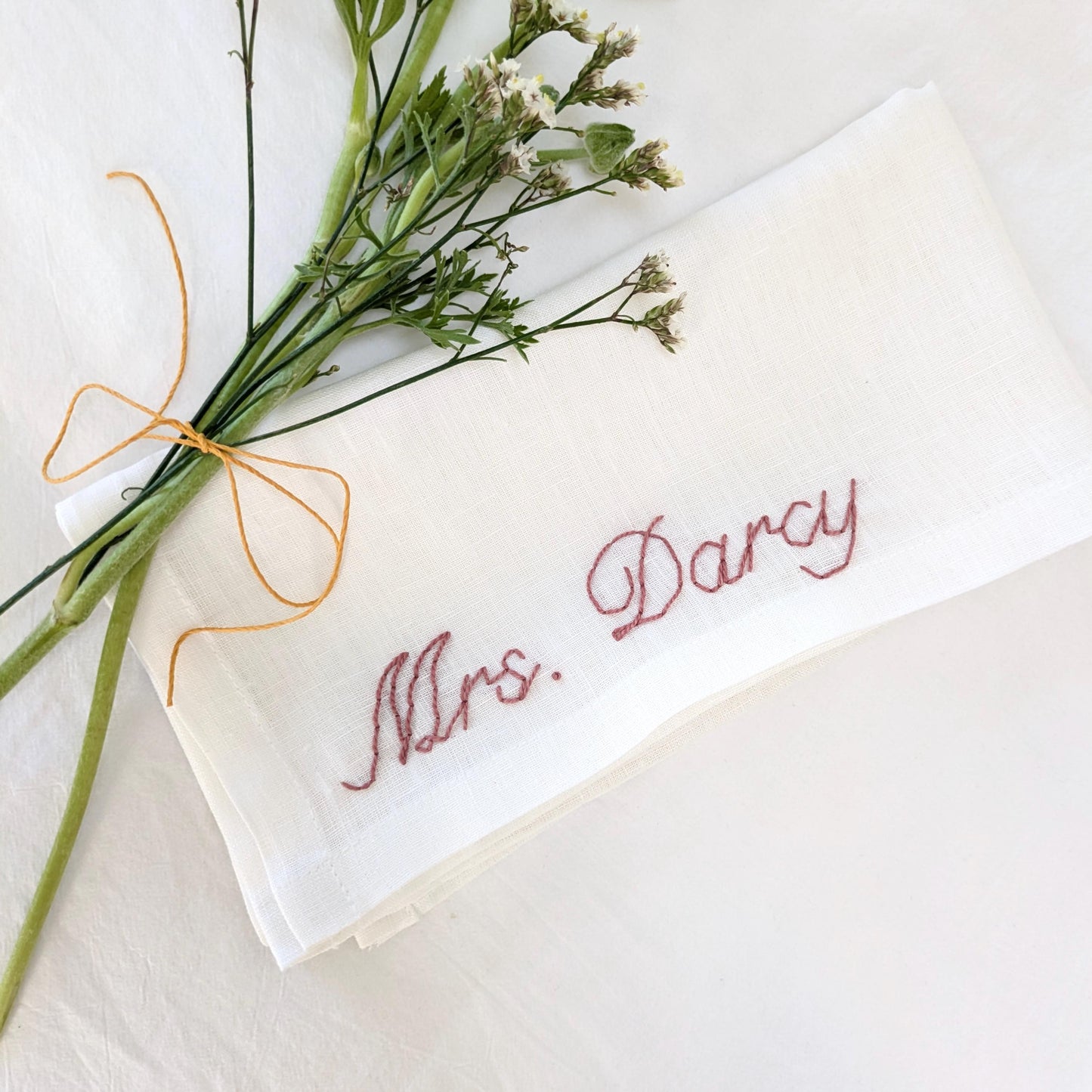 Ivory linen napkin with personalized hand embroidery