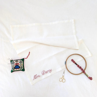 Hand embroidered ivory linen napkin with custom text