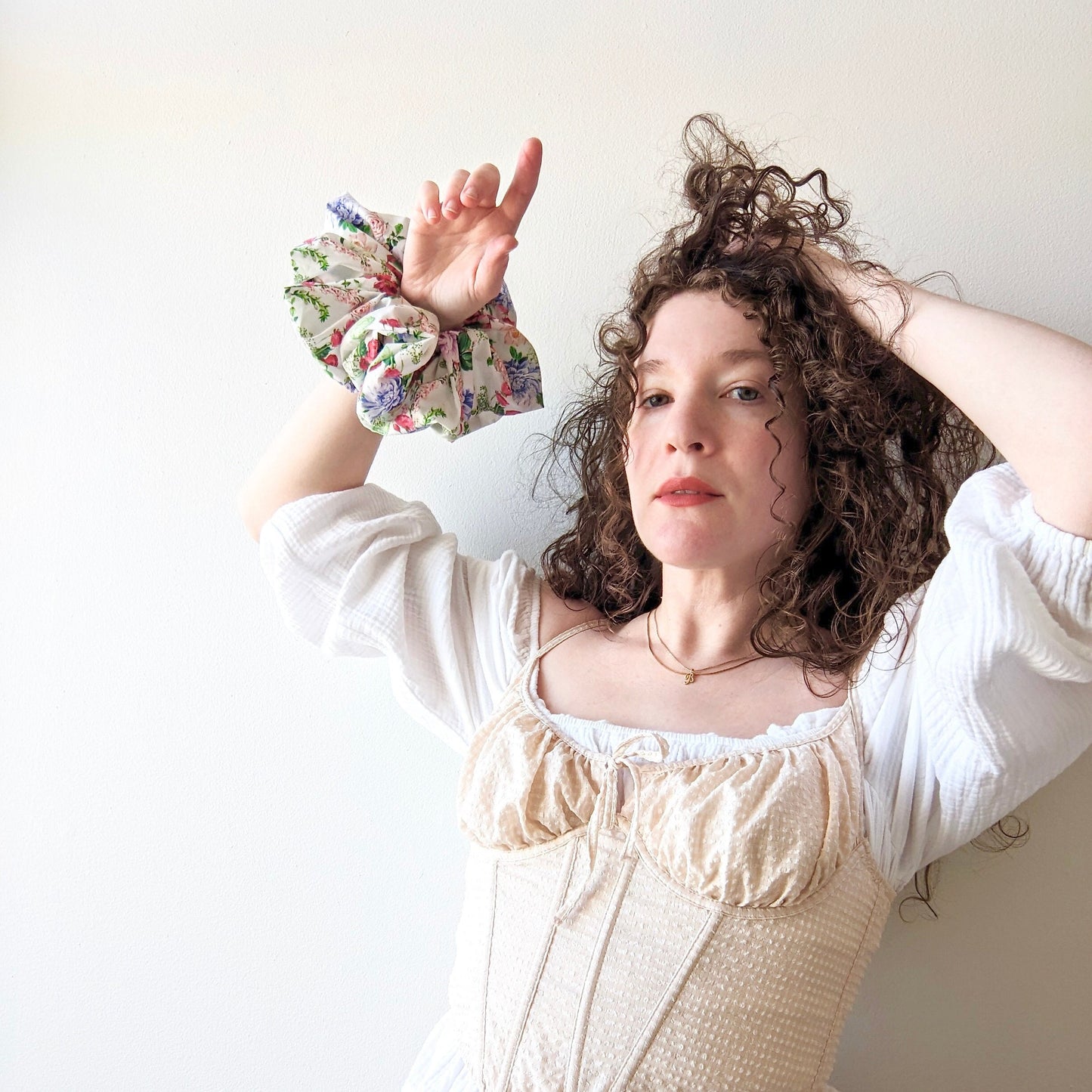 Big oversized cotton scrunchie with coquette floral motif and white background