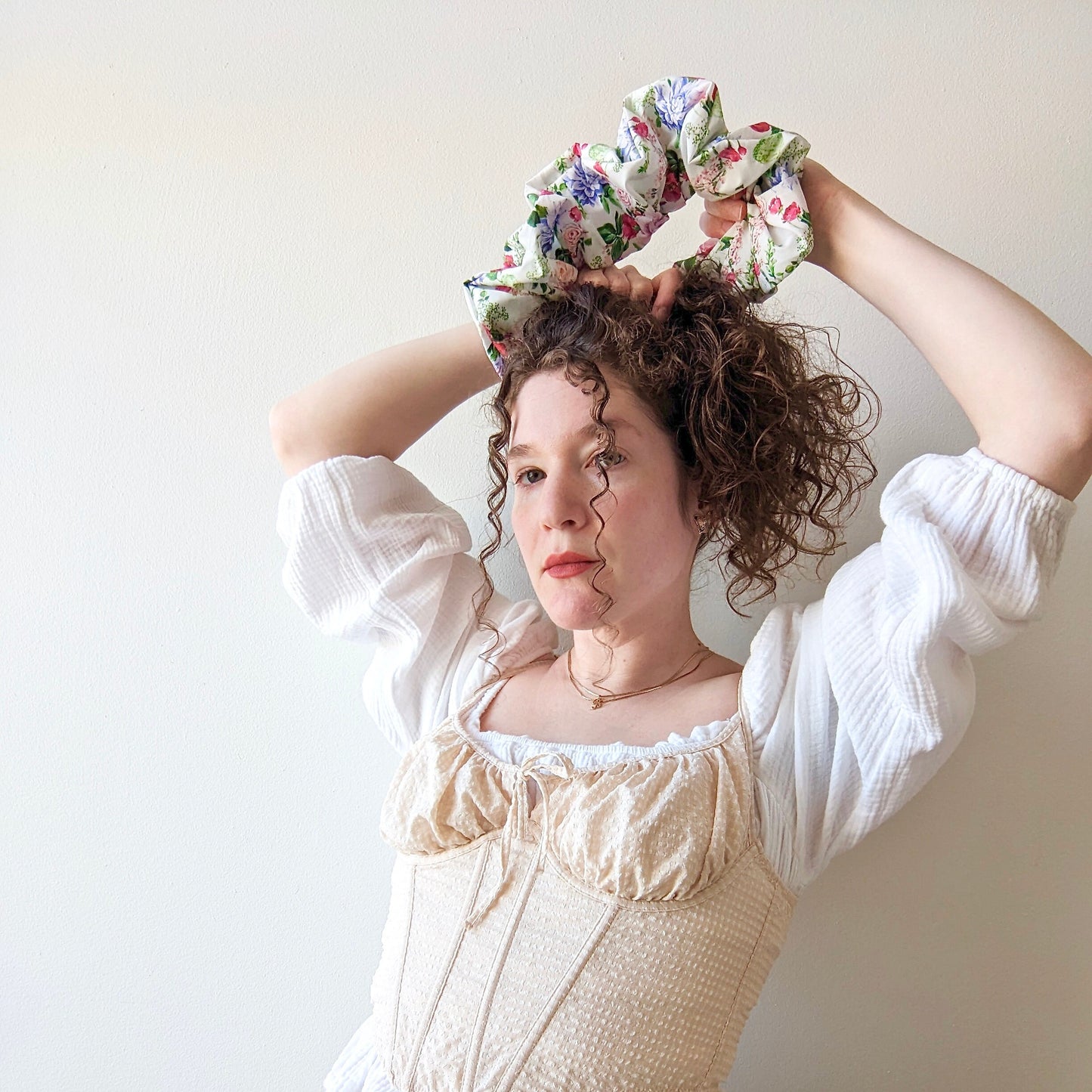 Giant scrunchie with coquette floral pattern and white background